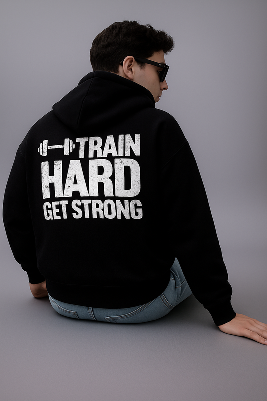 Black oversized hoodie with "Train Hard Get Strong" graphic.